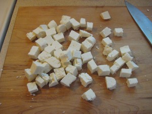 Diced paneer on the cutting board